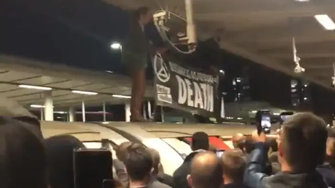 Angry commuters turned on XR protesters at Canning Town after they held up their train