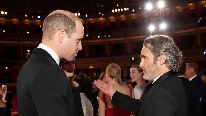 The Duke of Cambridge (left) talks to Joaquin Phoenix during the EE British Academy Film Awards at Royal Albert Hall
