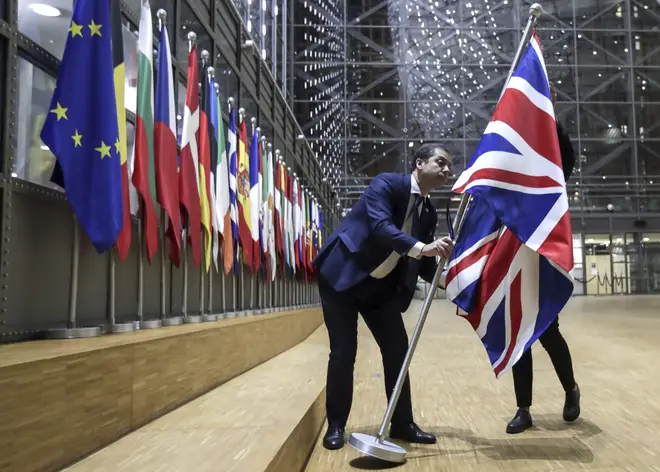 The Union flag being removed from the Europa building atrium in Brussels on Brexit Day