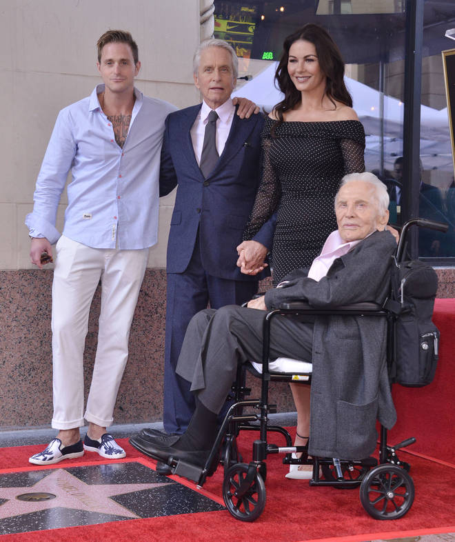 Kirk pictured with son Micheal, grandson Cameron and daughter-in-law Catherine Zeta-Jones at Micheal's Walk of Fame ceremony