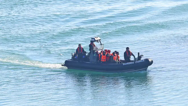A Border Force boat carrying migrants arrives in Dover