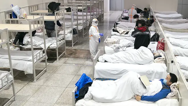Patients infected with the novel coronavirus are seen at a makeshift hospital converted from an exhibition center in Wuhan
