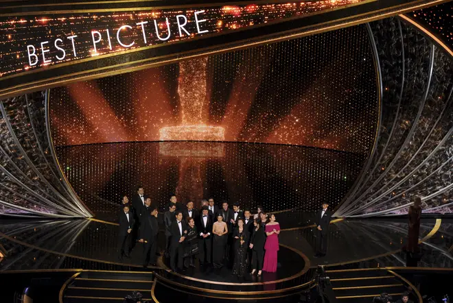 The cast gather to accept their award