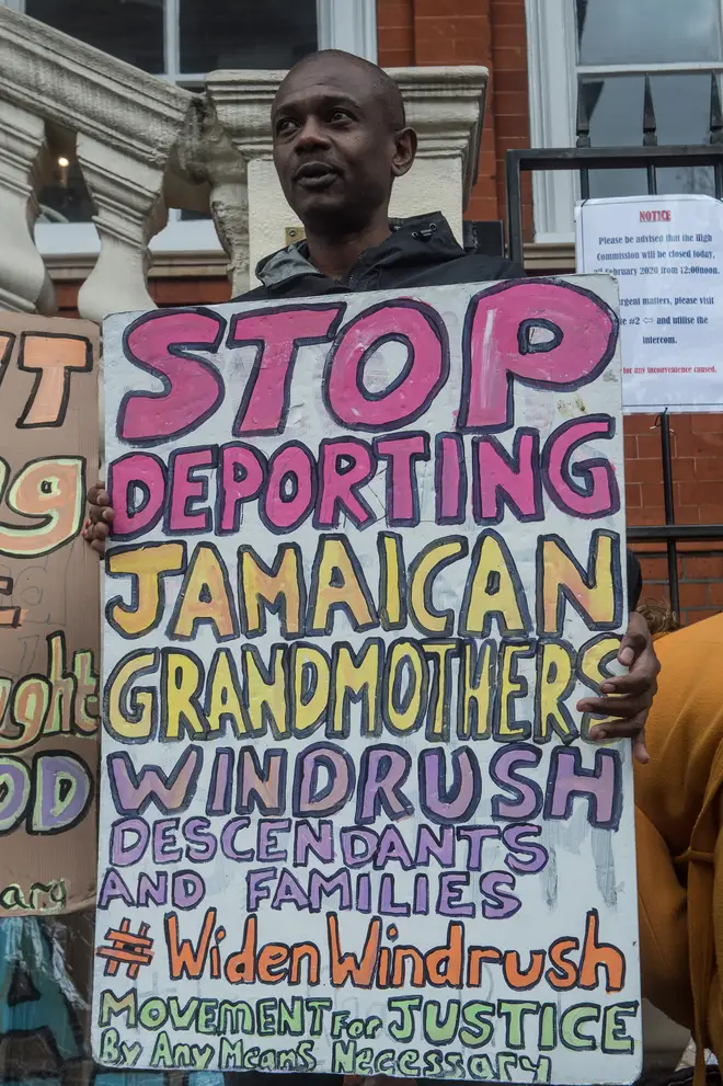 One protester with a sign outside the Jamaican embassy