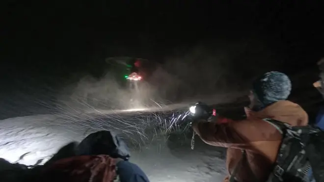 The group were airlifted to hospital after becoming trapped in blizzard conditions