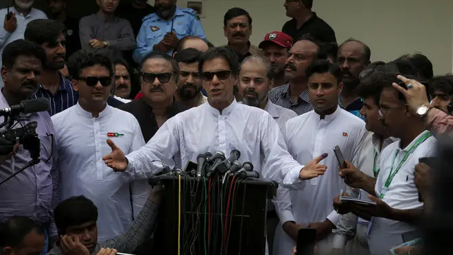 Imran Khan speaks to the media after casting his vote in the Pakistan general election.