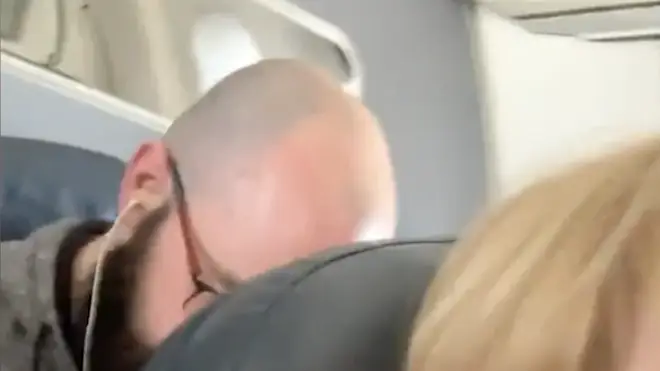Viral video of man "punching" woman&squot;s plane seat in chair recline debate sparks debate