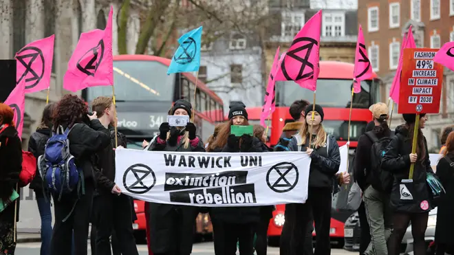 Extinction Rebellion protesters on the Strand, London as part of a protest against London Fashion Week
