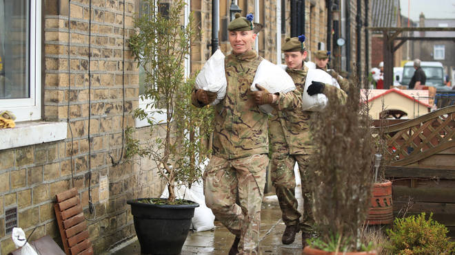Soldiers deliver sandbags to homes in the Upper Calder Valley in West Yorkshire
