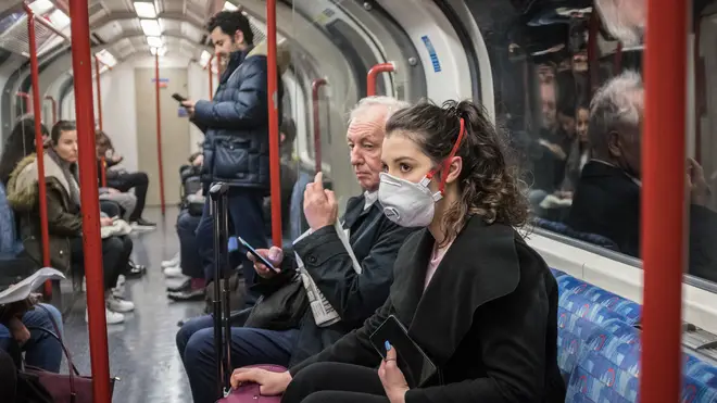 Tube passengers in London use masks for protection