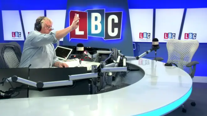 Nick Ferrari indicates to his producer that he wants to bring the next caller into the conversation