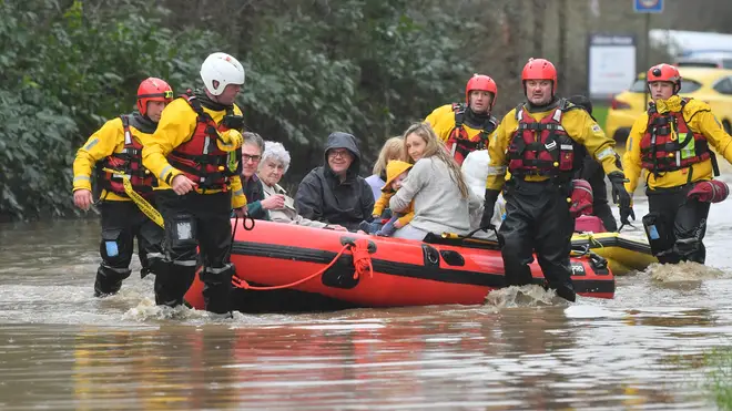 Members of the public are rescued after flooding in Nantgarw, Wales as Storm Dennis hit the UK