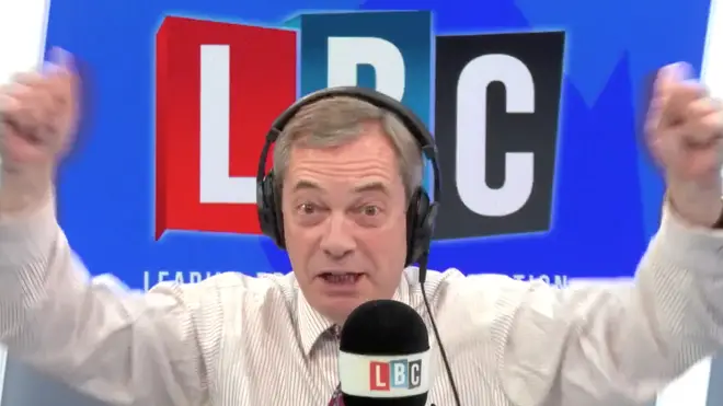 Nigel Farage waves hand in the studio