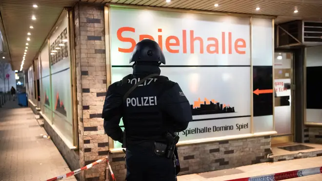 An armed German police officer at the scene of one of the attacks
