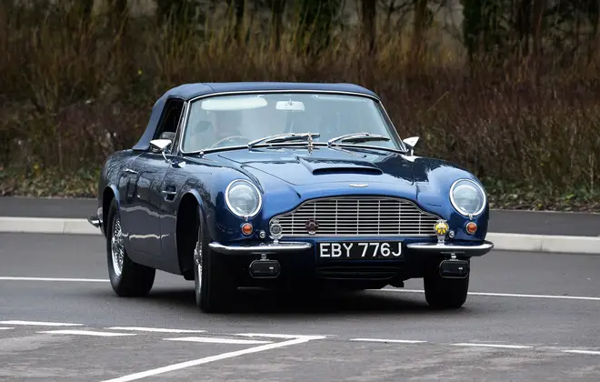 Prince Charles arrived in his wine-powered Aston Martin