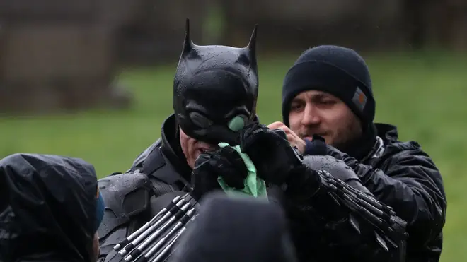The Dark Knight was seen wiping rain away from his goggles amid weather warnings