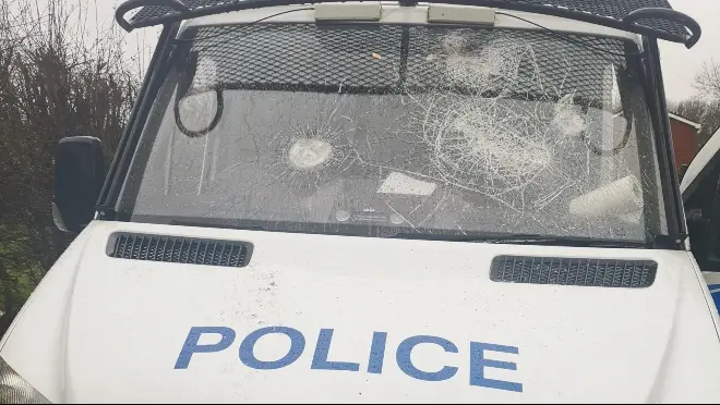 Three police vans were damaged by vandals in Salford