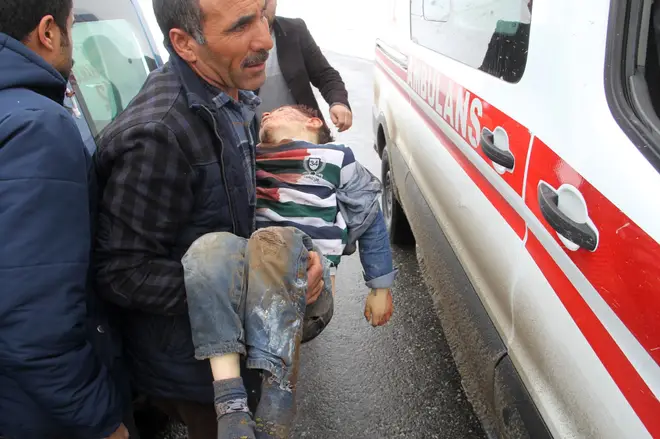 One man was spotted carrying an injured child to an ambulance following the quake