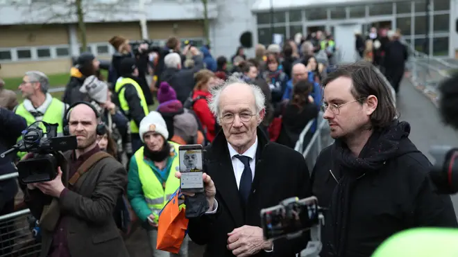 John Shipton (centre), the father of Julian Assange, at court