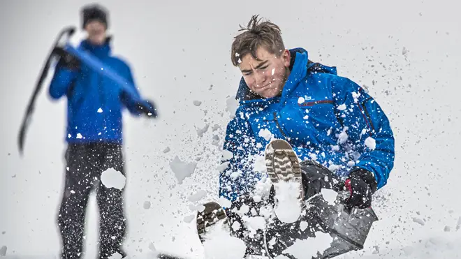 A boy enjoys the snowy weather on a sledge near Leyburn in the Yorkshire Dales