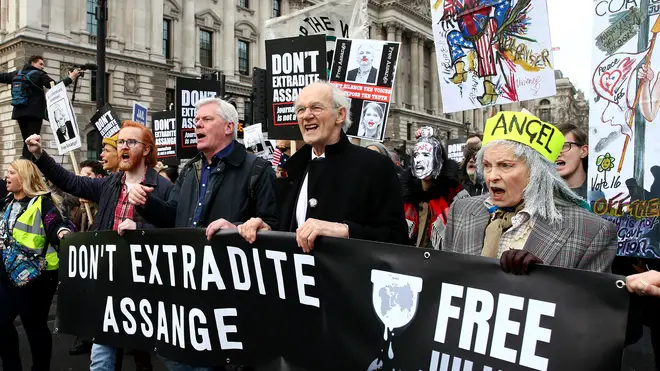 Protestors against the UK government's intention to extradite WikiLeaks founder Julian Assange to the United States