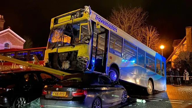 The bus mounted the parked cars outside Lingfield station on Monday evening