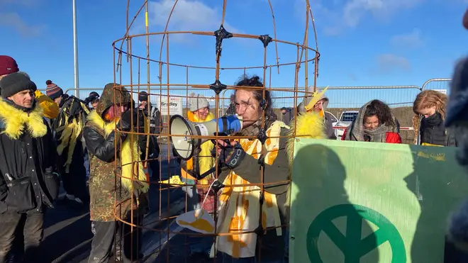 Some of the protesters are in cages