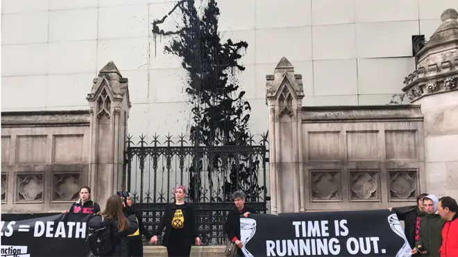 The protesters covered the hoarding in paint