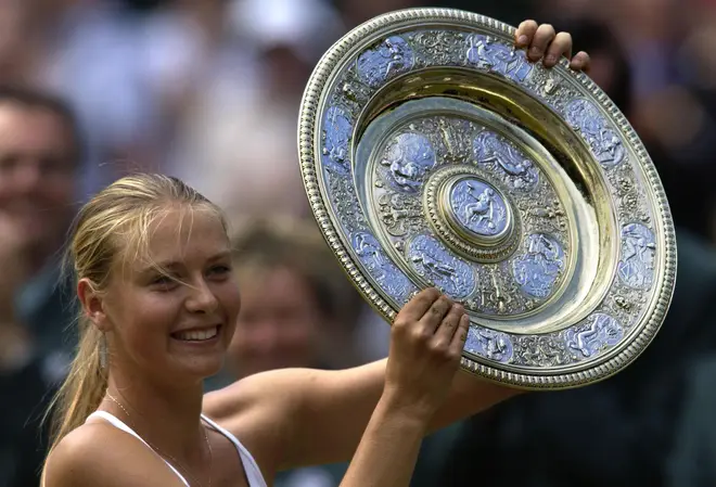Sharapova lifting the Wimbledon trophy in 2004 after beating Serena Williams