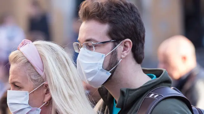A bearded man in Italy wears a facemask
