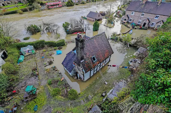 Some residents in Ironbridge, Shropshire, dug in despite the rising tide
