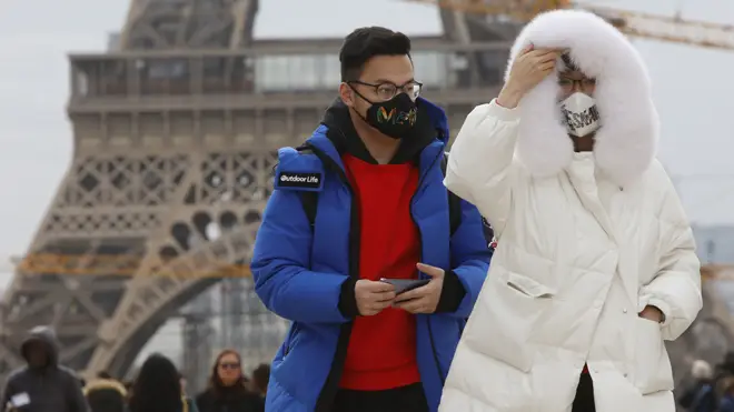 Tourists near the Eiffel Tower in Paris