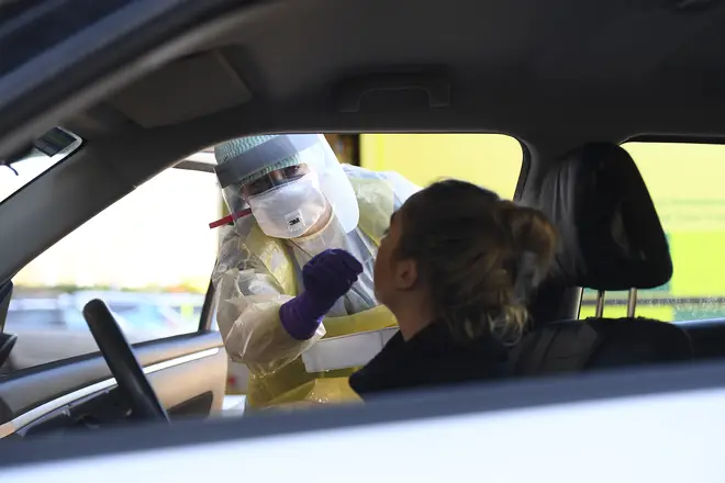 A nurse taking swabs at a coronavirus drive through test centre