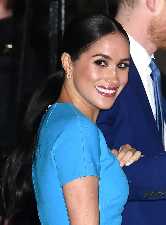 Meghan donned a blue Victoria Beckham dress for the event