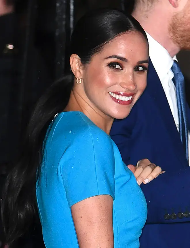 Meghan donned a blue Victoria Beckham dress for the event.