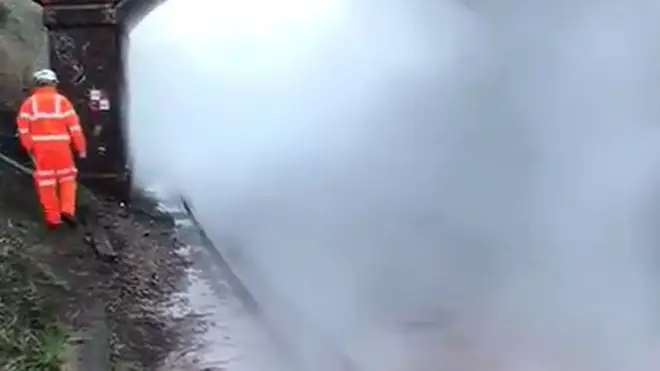 Steam is rising from the track bed