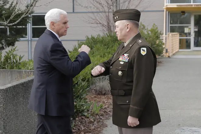US Vice President Mike Pence bumping elbows instead of shaking hands