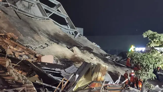 At least 30 people were pulled from the rubble after the Xinjia hotel in Quanzhou collapsed