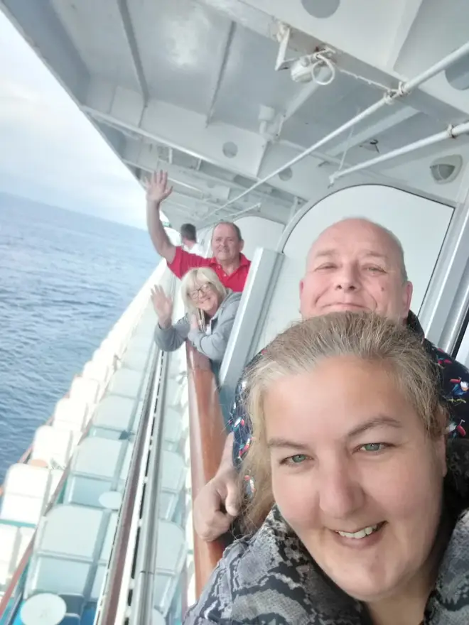 (Front to back) Justine and Dave Griffin, Sharon and Steve Lane from their balconies on the Grand Princess