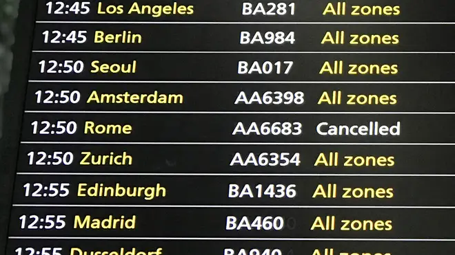 The passenger information board in Terminal 5 departures at Heathrow Airport as British Airways has announced that it has cancelled all flights to and from Italy which were scheduled today