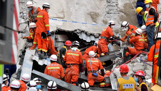 Rescue workers at the scene of the collapse
