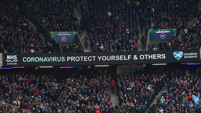 A message that reads: "Coronavirus protect yourself and others" is displayed during the Six Nations rugby union international match between Scotland and France