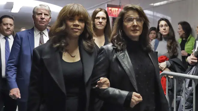 Accuser Annabella Sciorra, right, walks with friend Rosie Perez (left) as they arrived at the hearing