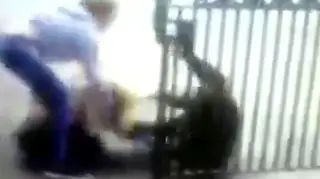 Two bullies hold down the school girl and repeatedly punch and kick her