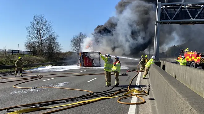 Thick smoke was seen billowing across the motorway as firefighters battled to control the blaze