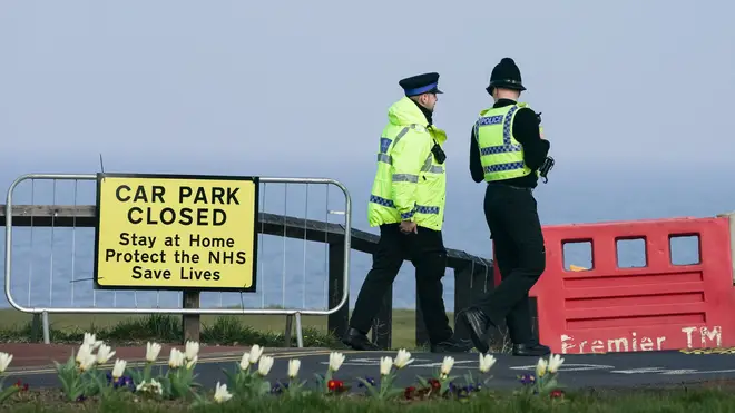 Police officers close a car park in Whitley Bay, Northumberland, as the UK continues in lockdown