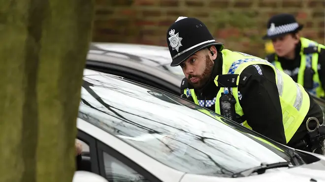 Police officers from North Yorkshire Police stop motorists in cars to check that their travel is "essential"