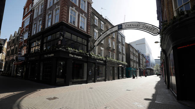 Carnaby Street with its fashion shops and cafes closed in London