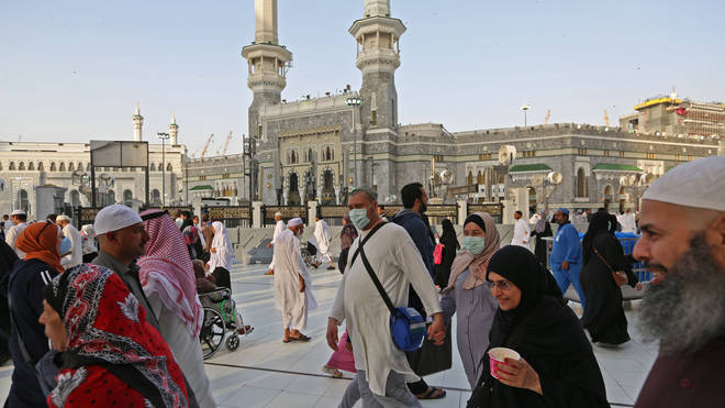 Muslim pilgrims wear masks at the Grand Mosque in Saudi Arabia's holy city of Mecca