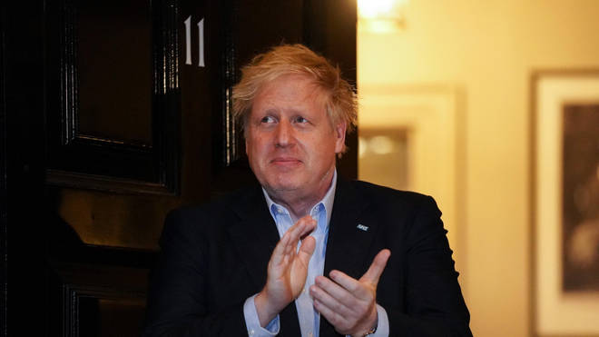 Boris Johnson clapping outside 11 Downing Street in London to salute local heroes during Thursday's nationwide Clap for Carers